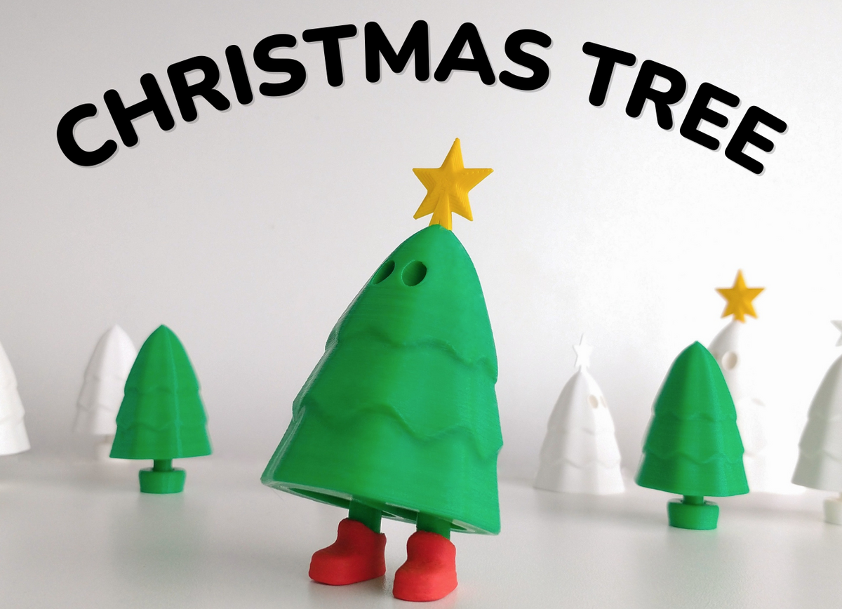 Toy Christmas tree with a star on a white background, labeled 'Christmas Tree'.