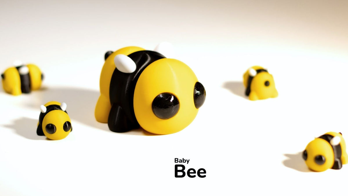 Toy bee with a baby bee text on a light background