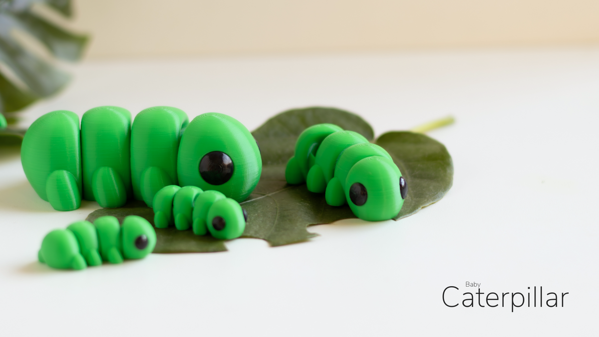 Group of green Baby Caterpillar fidget toys