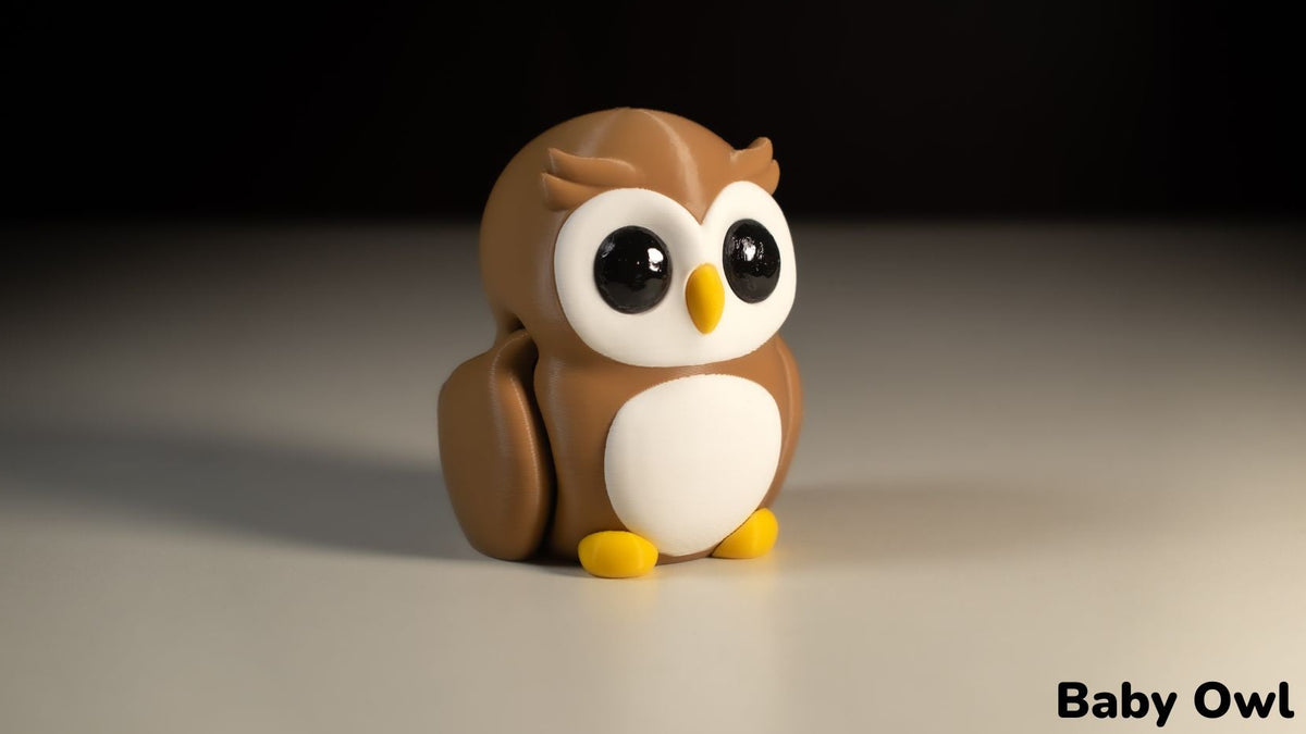 Toy owl figurine on a neutral background with 'Baby Owl' text