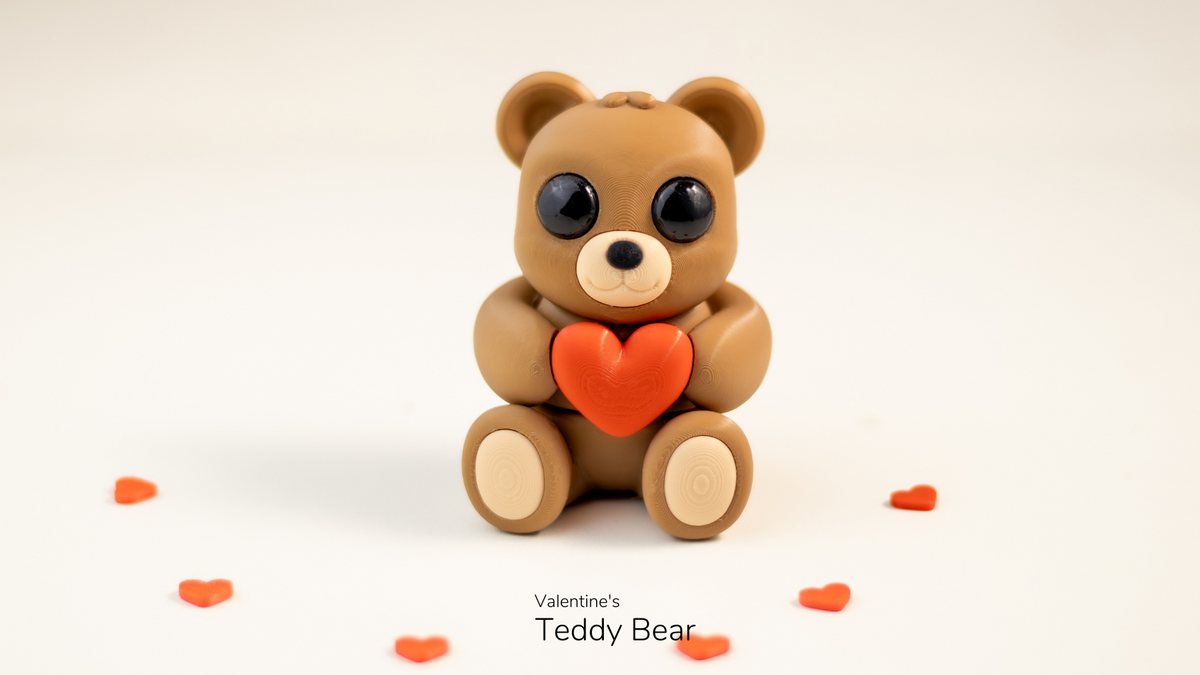 Teddy bear with an orange heart on a white background