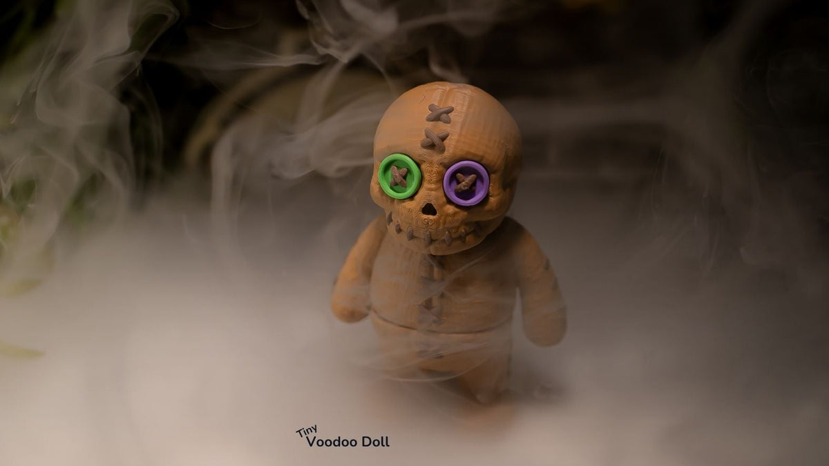 Tiny Voodoo Doll, close up of button eyes