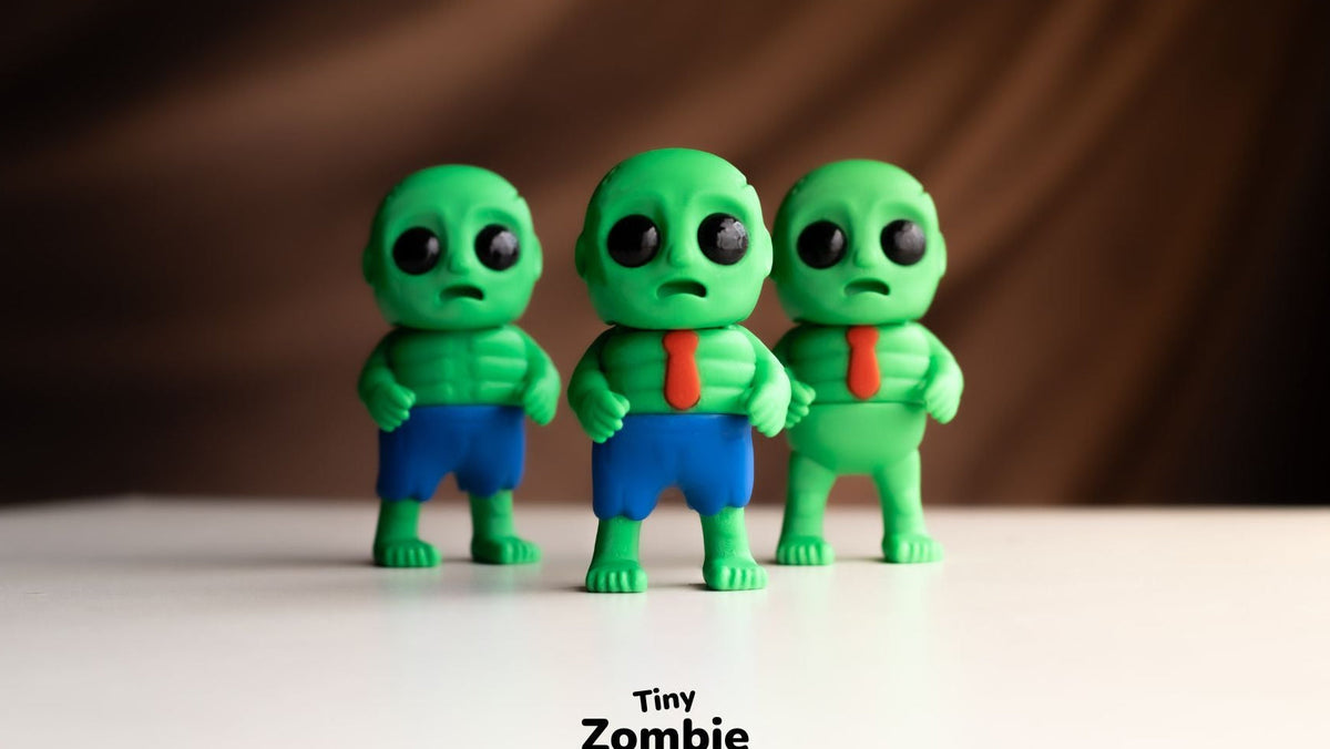 Row of green Tiny Zombie figures