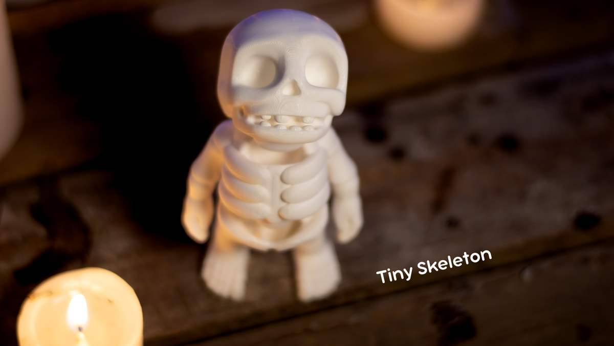 Cream Tiny Skeleton figure with candles in the dark