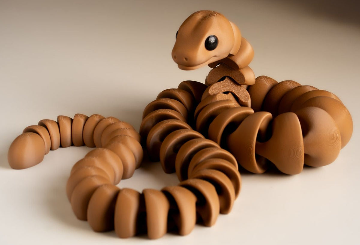 Long brown Snake fidget toy coiled up
