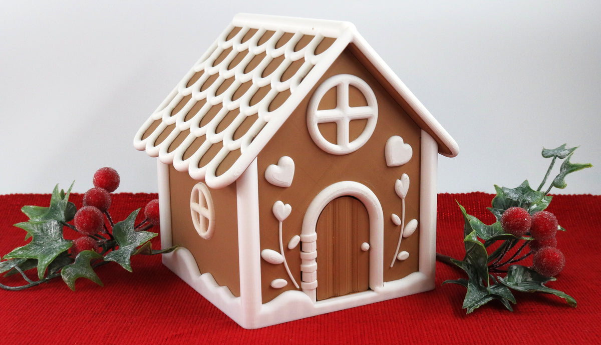 Gingerbread House Playset with white icing on a red background