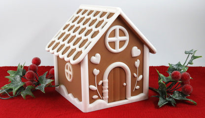 Gingerbread House Playset with white icing on a red background