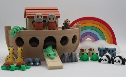 Noah's Ark toy set with animals and rainbow on a white background