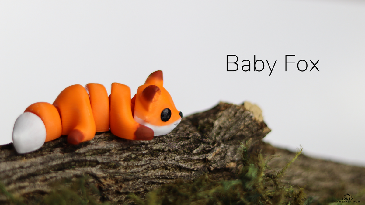 Baby Fox fidget toy curled on a branch