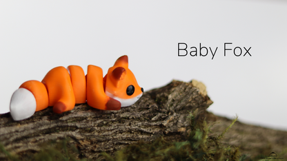 Baby Fox fidget toy curled on a branch