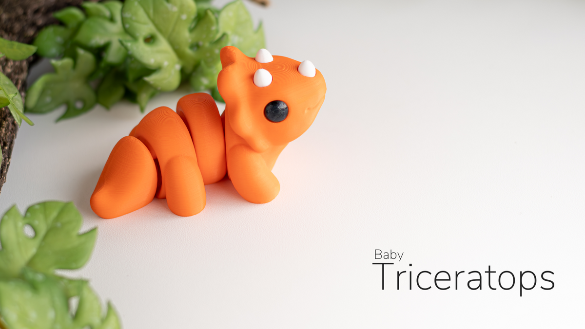 Orange Baby Triceratops with leaves behind