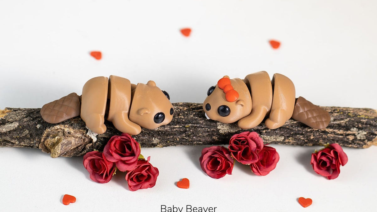 Two baby beavers on a branch with red flowers and heart-shaped petals on a white background