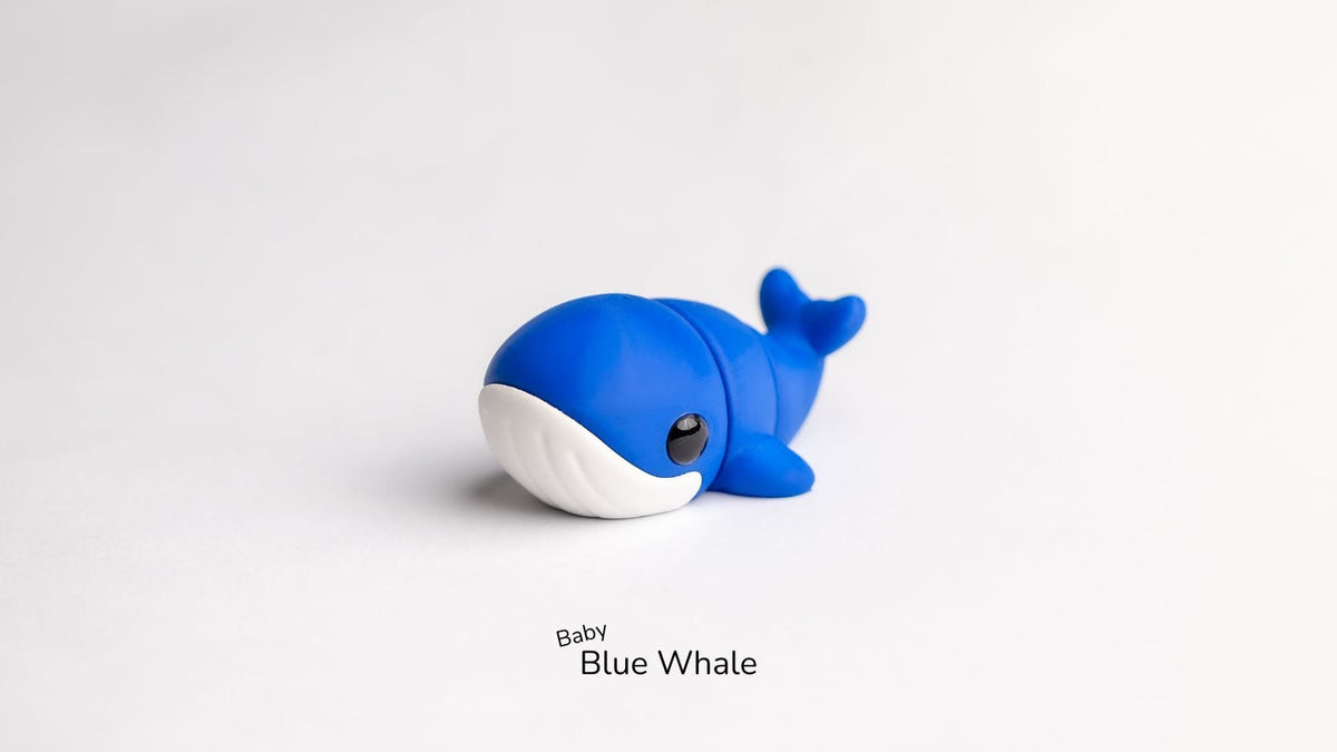 Blue whale toy on a white background