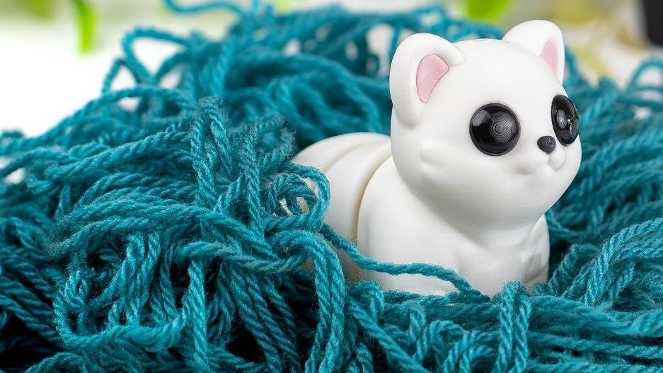 White Baby Cat with pink ears in teal yarn
