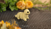 Cream Baby Golden Retriever on a cutting mat with roses