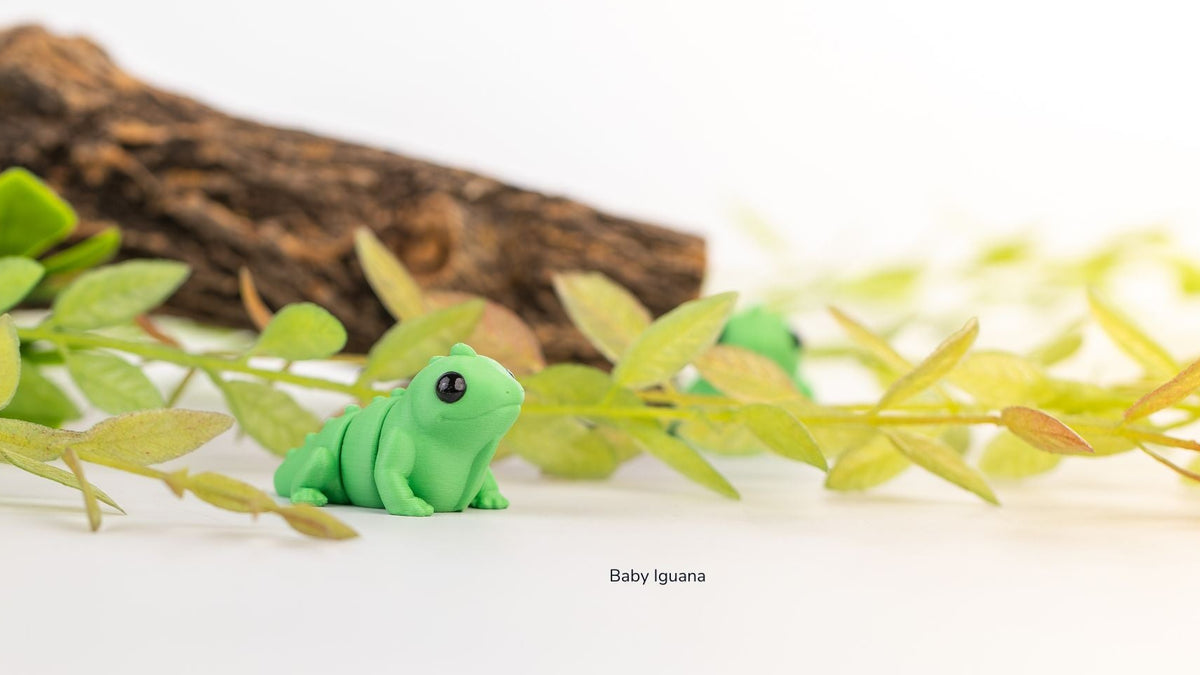 Green Baby Iguana on a wooden branch with plants