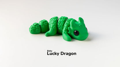 Green dragon toy with 'Baby Lucky Dragon' text on a white background