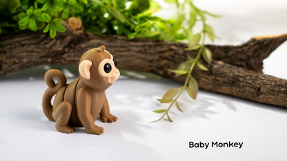 Baby Monkey sitting in front of a log