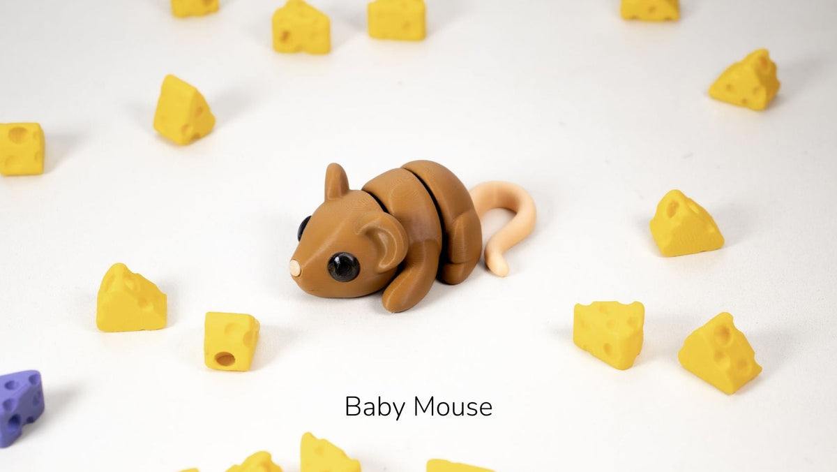 Toy mouse surrounded by yellow blocks on a white background