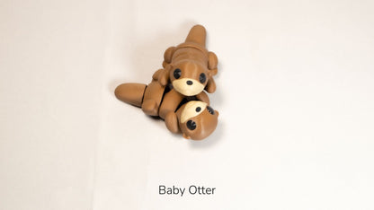 Brown Baby Otter fidget toy lying on its back