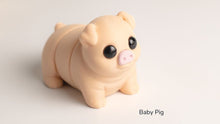 Peach Baby Pig fidget toy with a pink snout