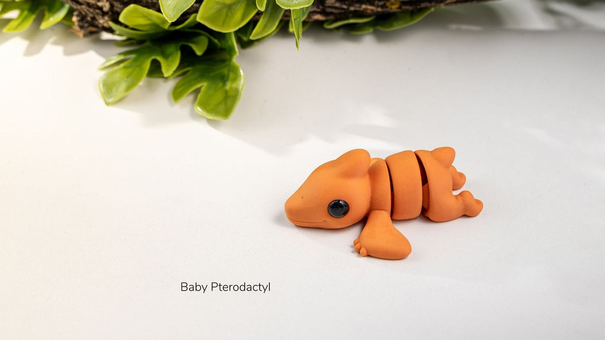 Orange Baby Pterodactyl with wings spread