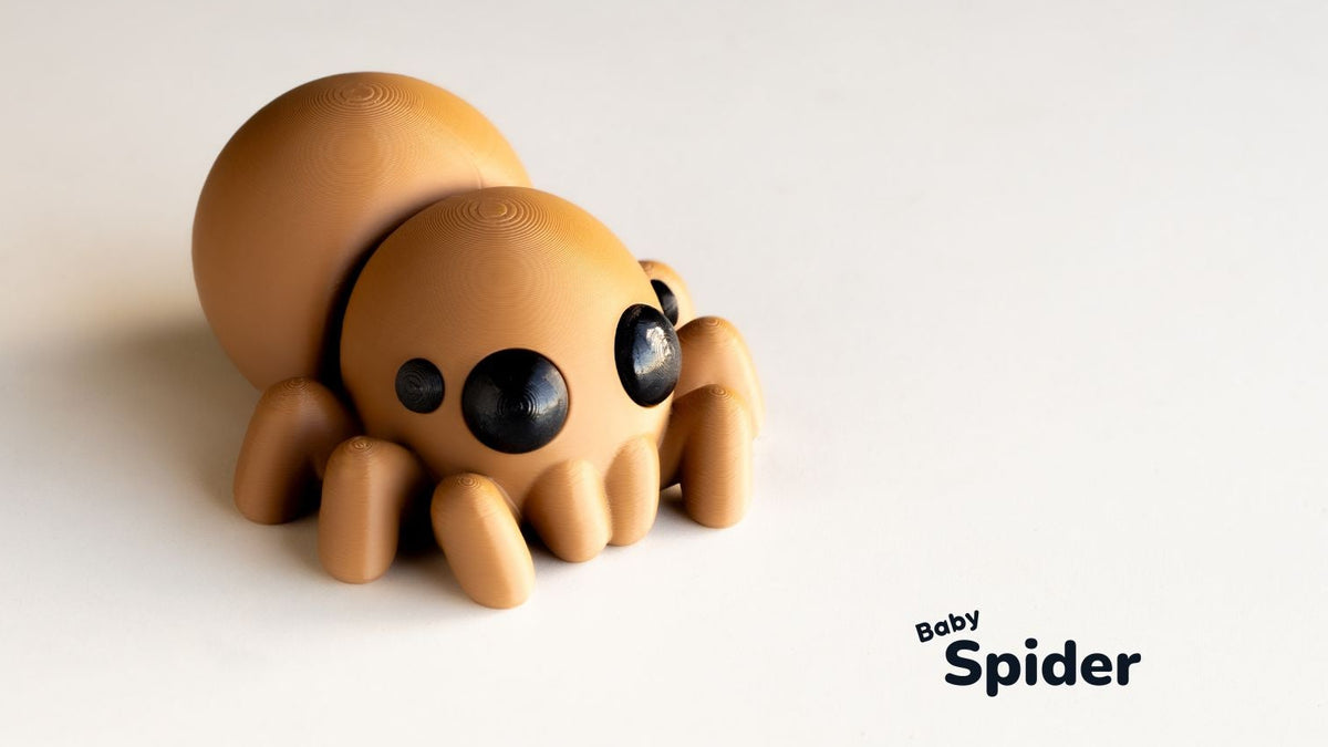 Toy spider on a white background with 'Baby Spider' text