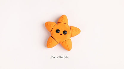 Orange baby starfish toy on a white background