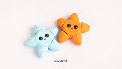 Two star-shaped toys, one blue and one orange, on a white background with 'Baby Starfish' text.
