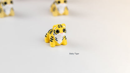 Baby Tigers in yellow and white with black stripes