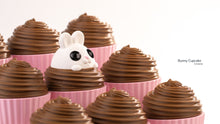 Bunny Cupcake Containers with chocolate tops and a white bunny peeking out