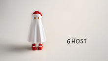 Ghost-like figure with a white robe, red shoes, and hat on a light gray background.