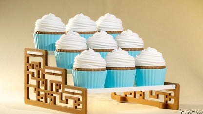 Cupcakes with white frosting and blue wrappers on a decorative wooden stand against a beige background.