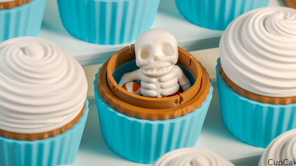 Cupcake Containers with blue cases and cream tops, one holding a tiny skeleton