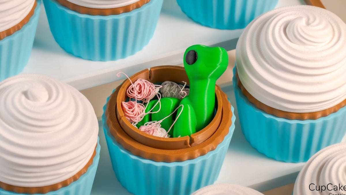 Open Cupcake Container with a green dinosaur inside