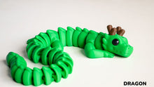Green dragon toy on a white background