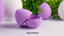 Purple egg-shaped container with a white background and greenery