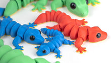 Blue and red Gecko fidget toys together