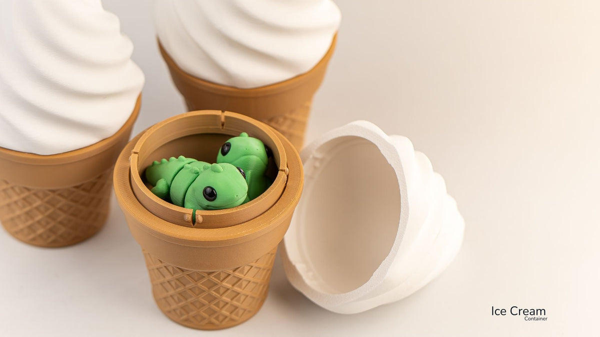 Toy ice cream cone set with a small green toy inside, resembling ice cream.