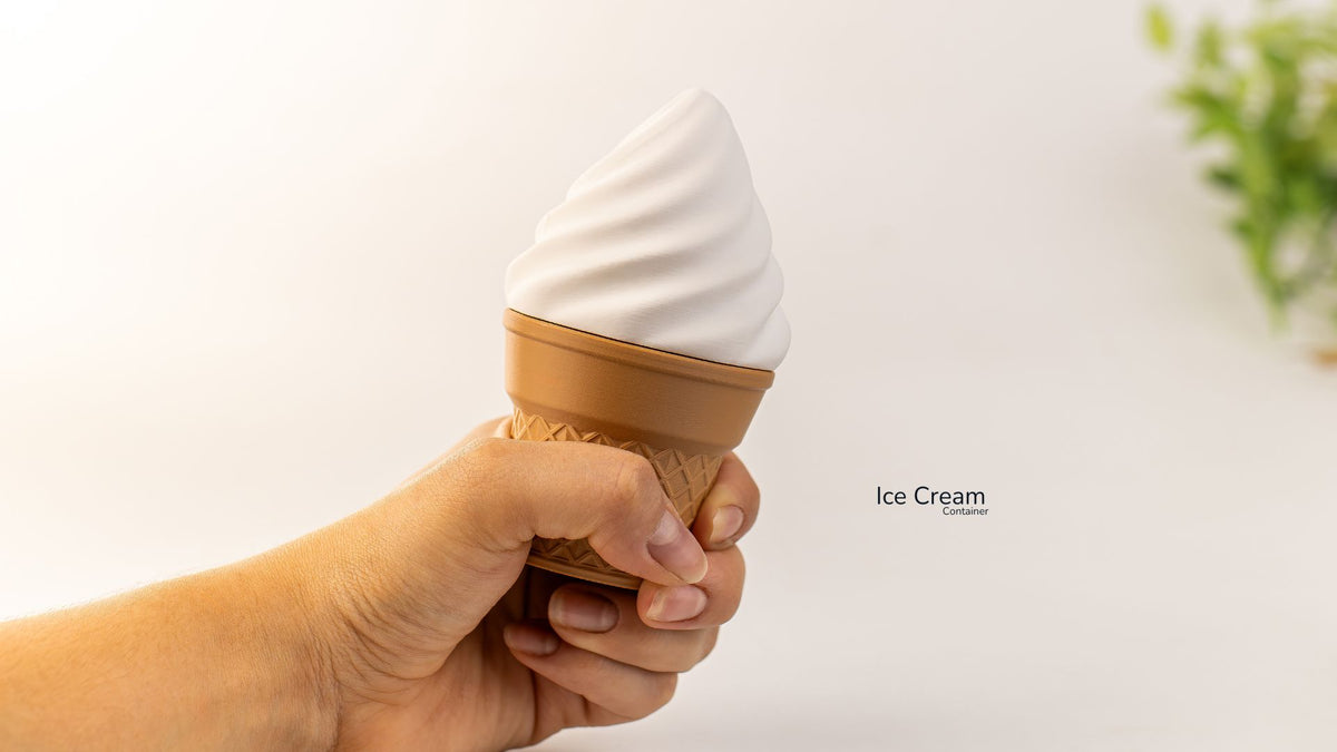 Hand holding a cream Ice Cream Container shaped like a cone
