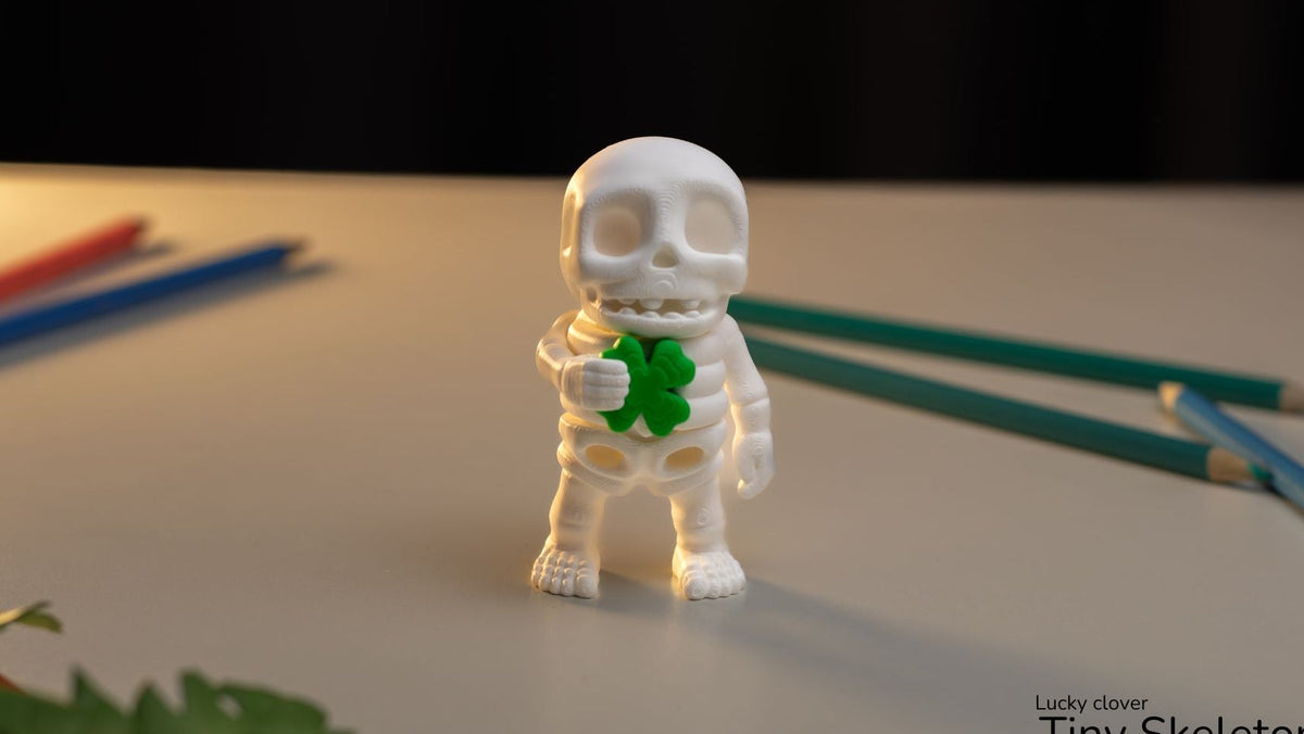 Lucky Clover Tiny Skeleton holding a green clover
