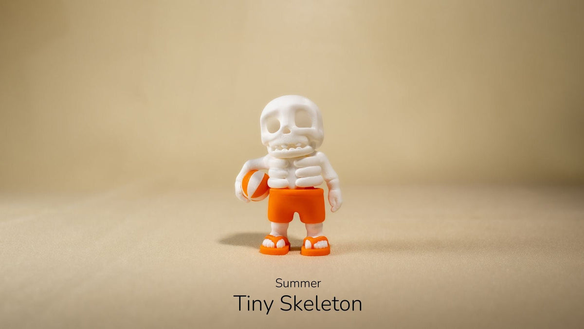 Summer Tiny Skeleton wearing a white hat and orange shorts