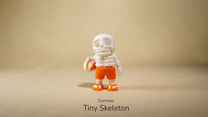 Summer Tiny Skeleton wearing a white hat and orange shorts