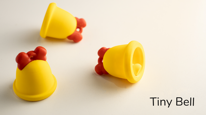Three yellow Tiny Bells with red ribbon bows