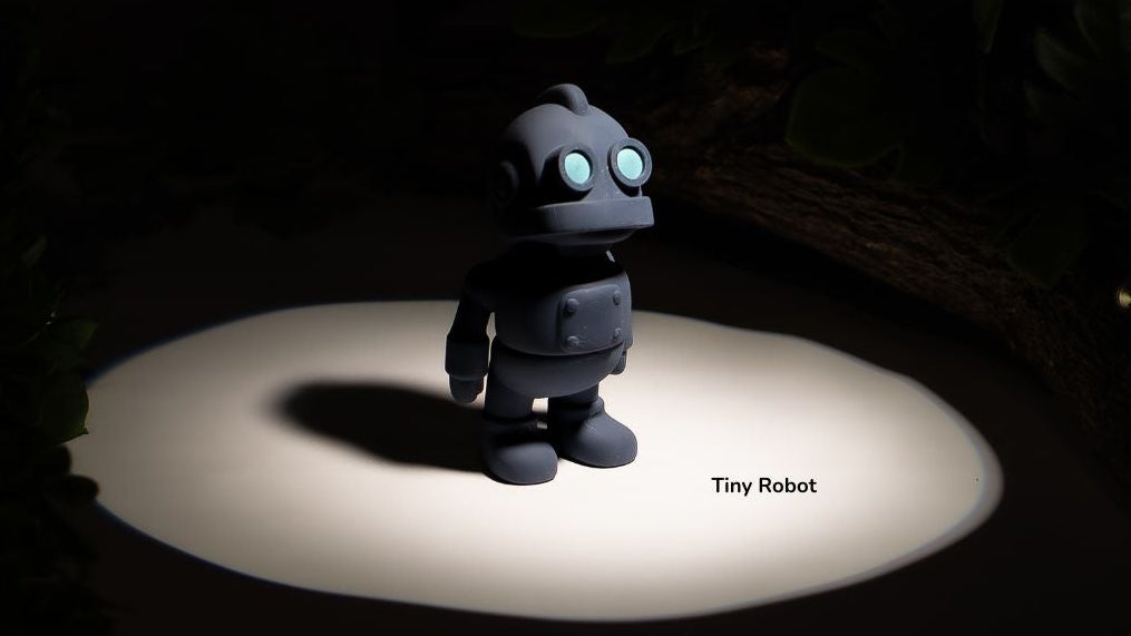 Toy robot on a dark background with a spotlight effect