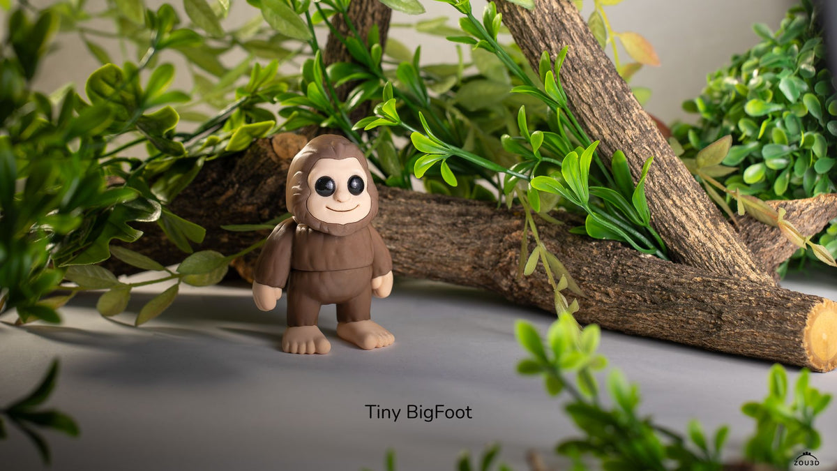Brown Tiny Bigfoot with greenery behind