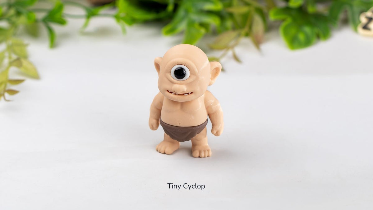 Small Cyclops figure standing among leaves
