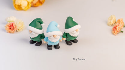 Three Tiny Gnomes in green and blue hats with flowers