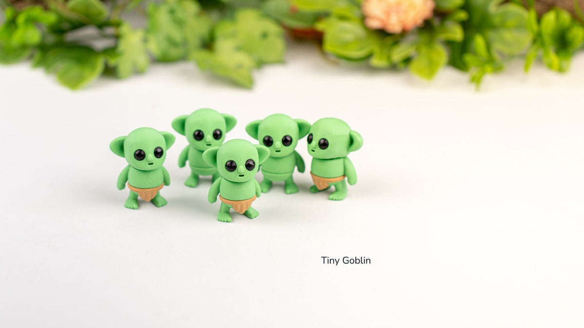 Four green Tiny Goblins in a row