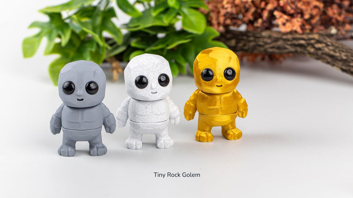 Grey, white and yellow Tiny Rock Golems together